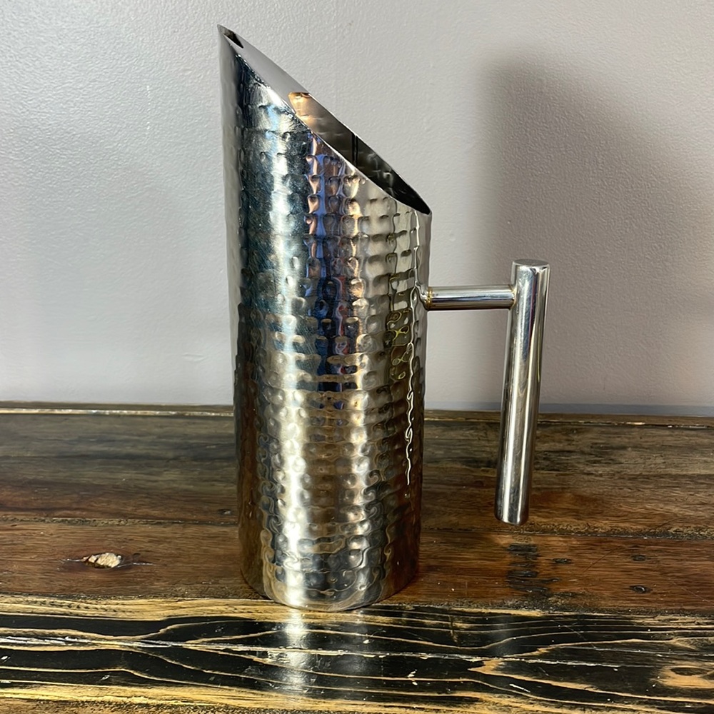 Hammered metal pitcher.  Simply elegant.